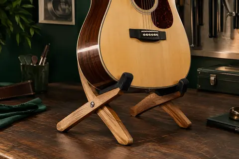 Support de guitare en bois naturel à forme X, avec des appuis rembourrés en tissu noir